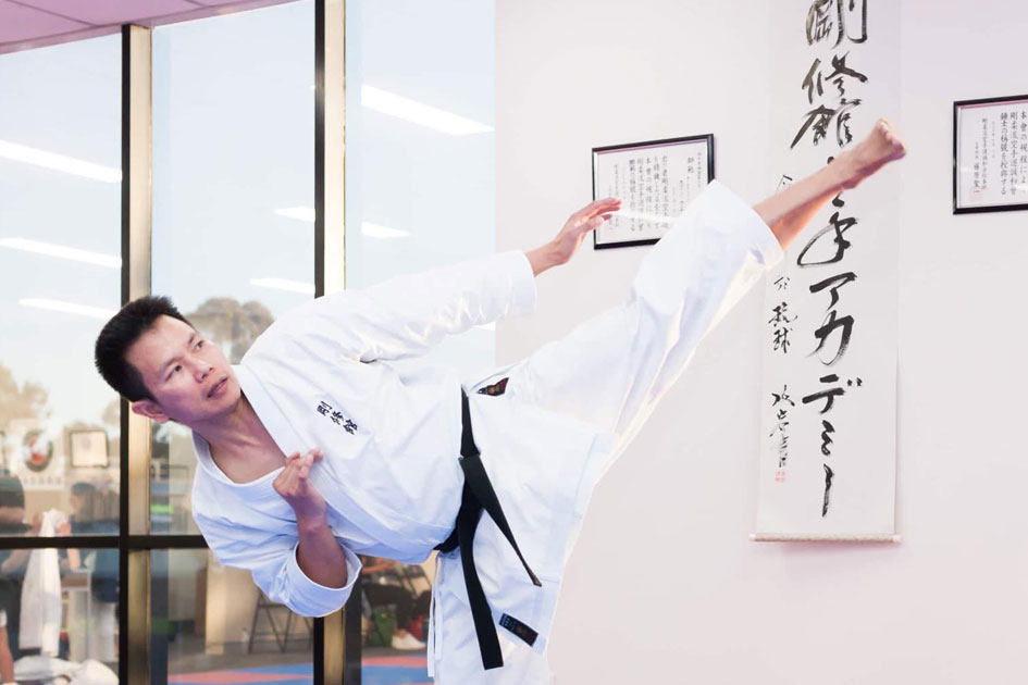 Ben Brillante Sensei doing a roundhouse kick at Goshukan Karate Academy Seven Hills dojo